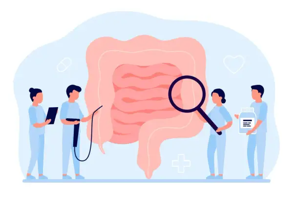 Medici esaminano un intestino ingrandito, simbolo di diagnosi e cura per la colite ulcerosa. Uno tiene una pillola, un altro una bottiglia di farmaci.